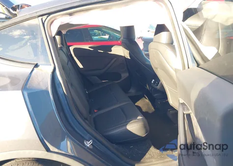 2023 Tesla Model Y Awd/Long Range Dual Motor All-Wheel Drive z USA, uszkodzony, nr VIN 7SAYGDEE1PA061587